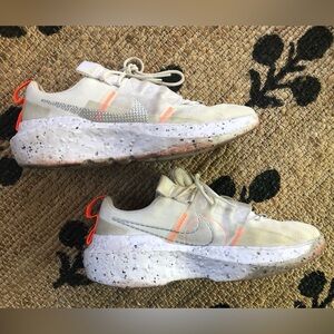 Nike Women’s Impact Crater Cream and Orange Athletic Shoes